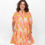 Woman wearing a floral dress on a white background