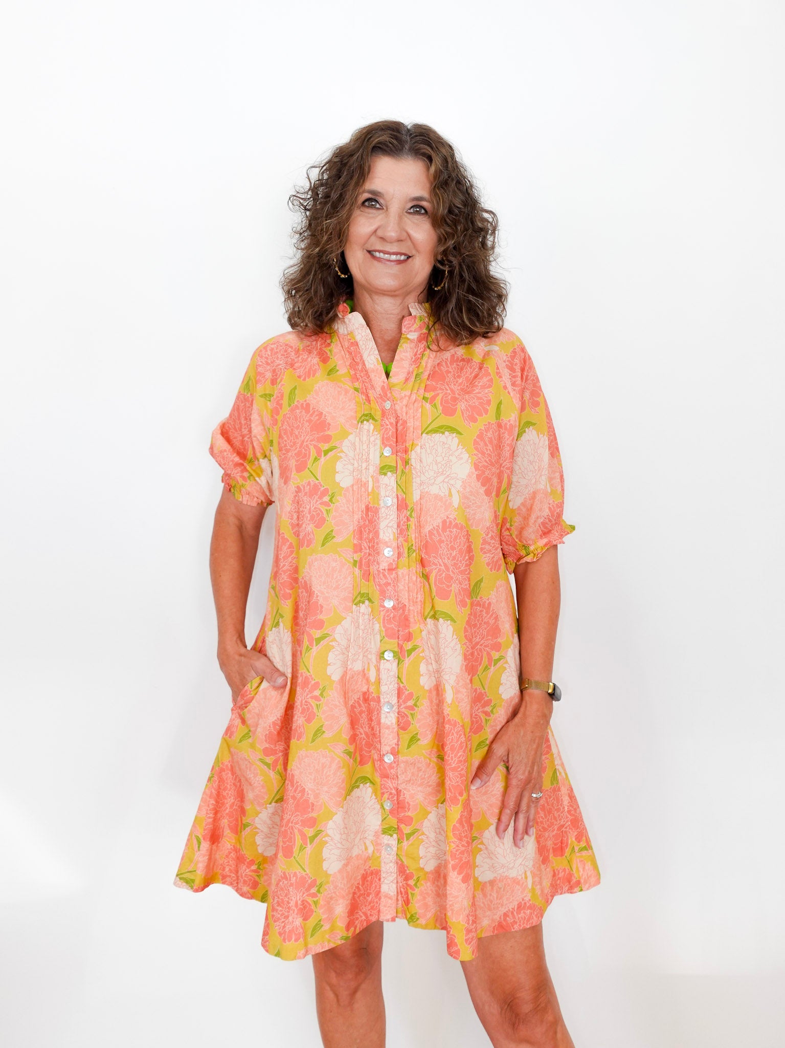 Woman wearing a floral dress on a white background
