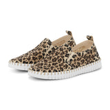 Leopard print slip-on shoes with white soles on a white background
