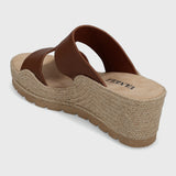 Brown sandal with jute sole on a light gray background