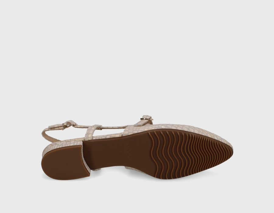 Flat sandal with brown sole on a light gray background