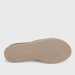 Beige shoe sole on a light gray background