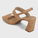 Pair of cork sandals on a light gray background