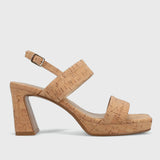 Cork sandal with a block heel on a light gray background