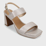 Silver high-heeled sandal on a light gray background