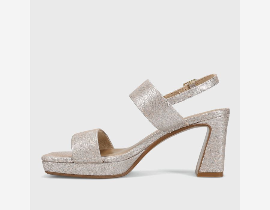 Silver glitter high-heeled sandal on a white background