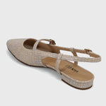 Beige sandal with a strap on a light gray background