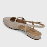 Beige sandal with a strap on a light gray background