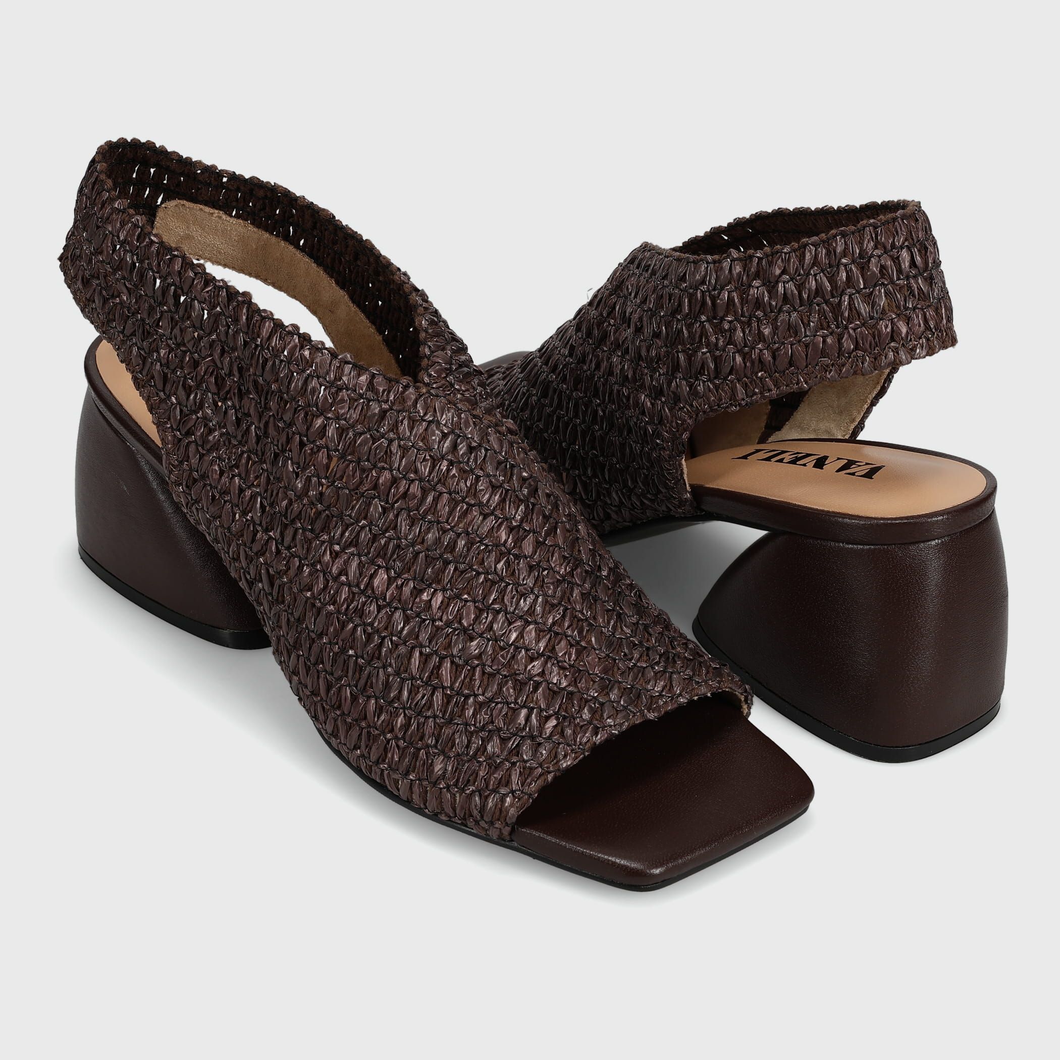 A pair of women's dark brown slingback block-heel sandals with a textured woven upper and open toe, shown on a light gray background.