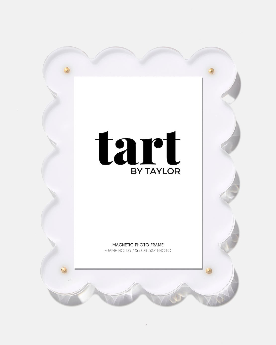 White scalloped photo frame with 'tart by Taylor' branding on a white background