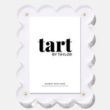 White scalloped photo frame with 'tart by Taylor' branding on a white background