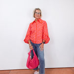 Woman wearing cropped wide leg pants with front patch pockets and a relaxed fit.