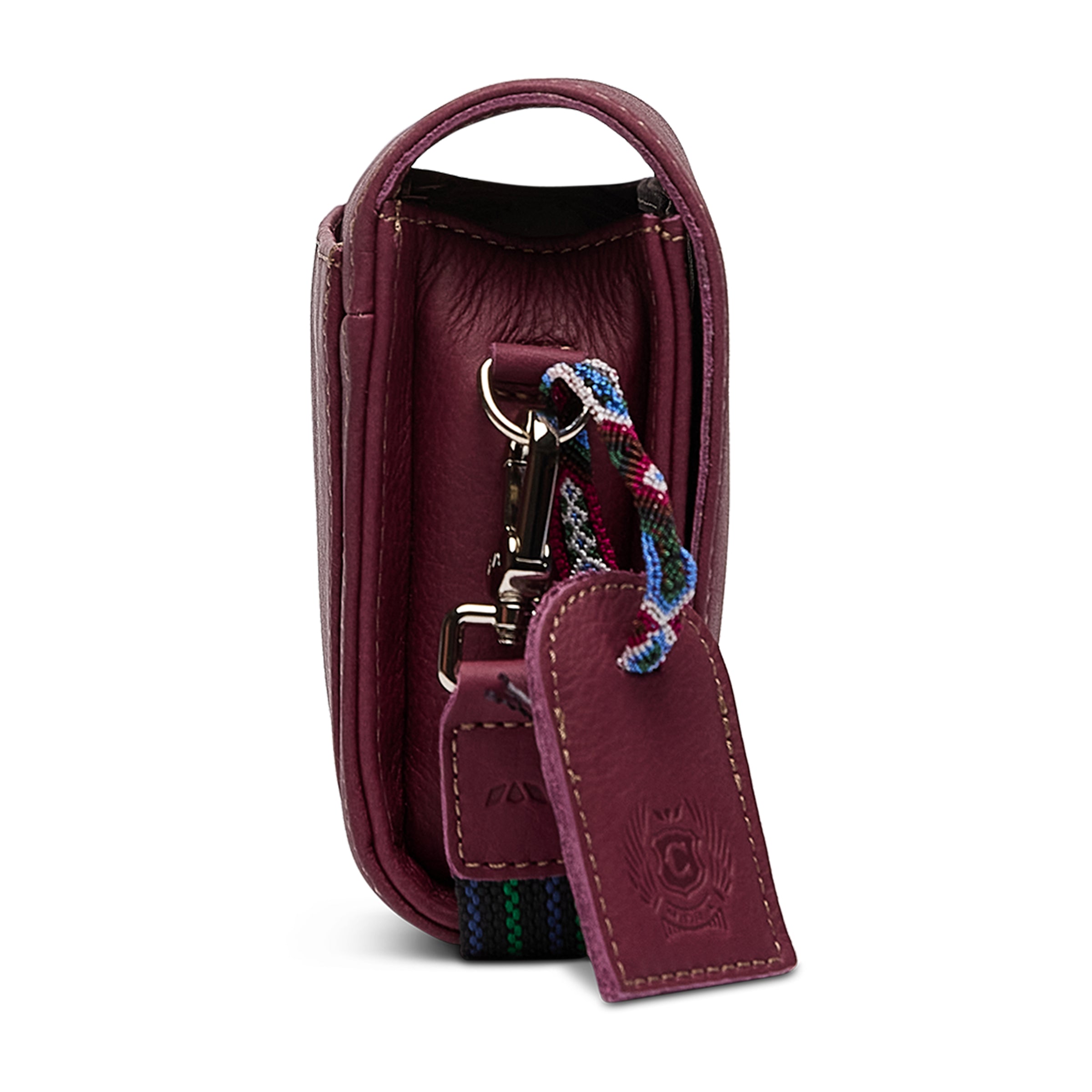 Consuela Plum On The Town Crossbody featuring a deep plum exterior, compact silhouette, and hands-free adjustable strap.