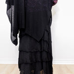 Black layered dress with ruffles on a white background