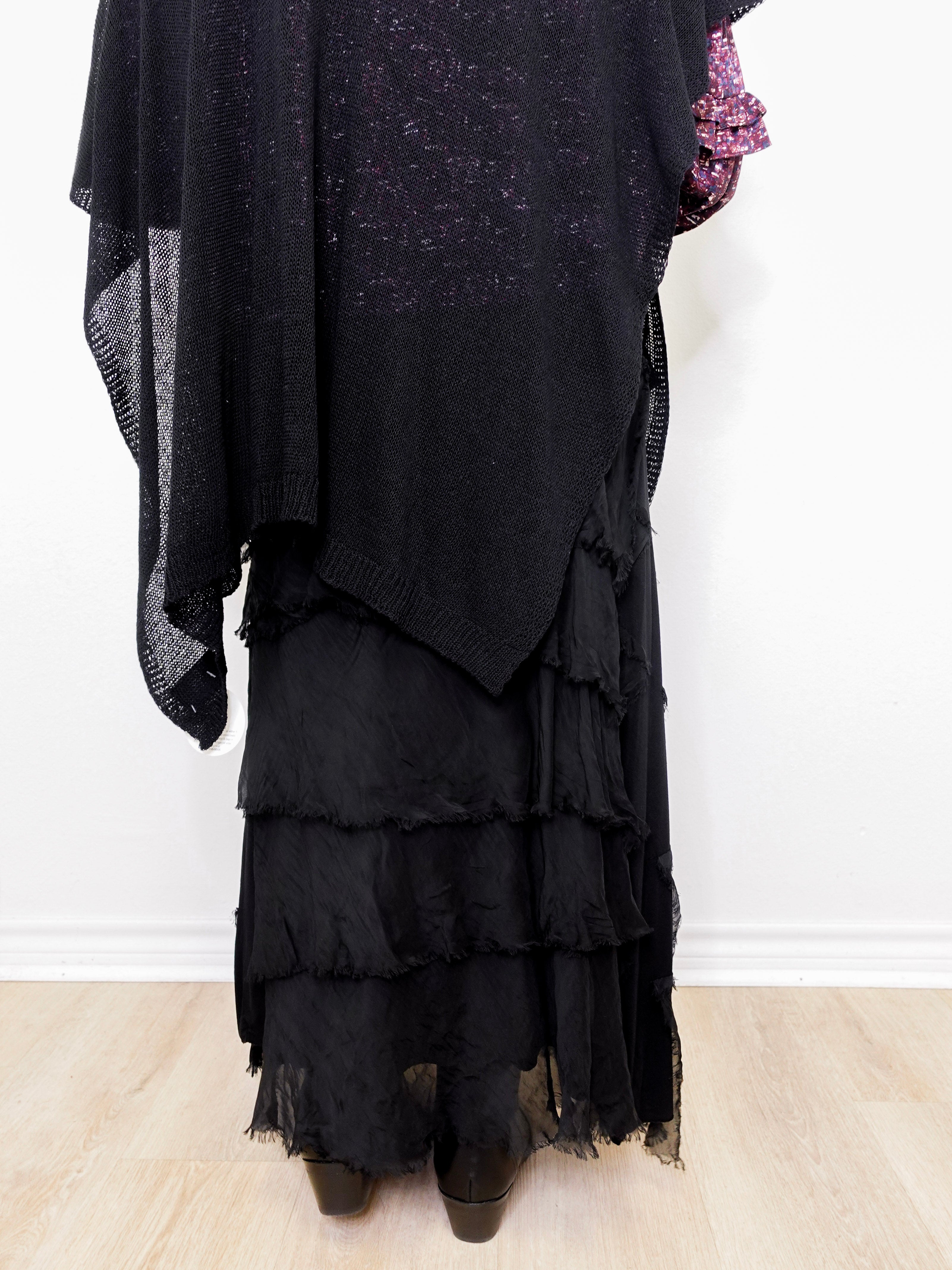 Black layered dress with ruffles on a white background