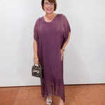 model wearing the helen silk kaftan long dress in eggplant with a flowy silhouette