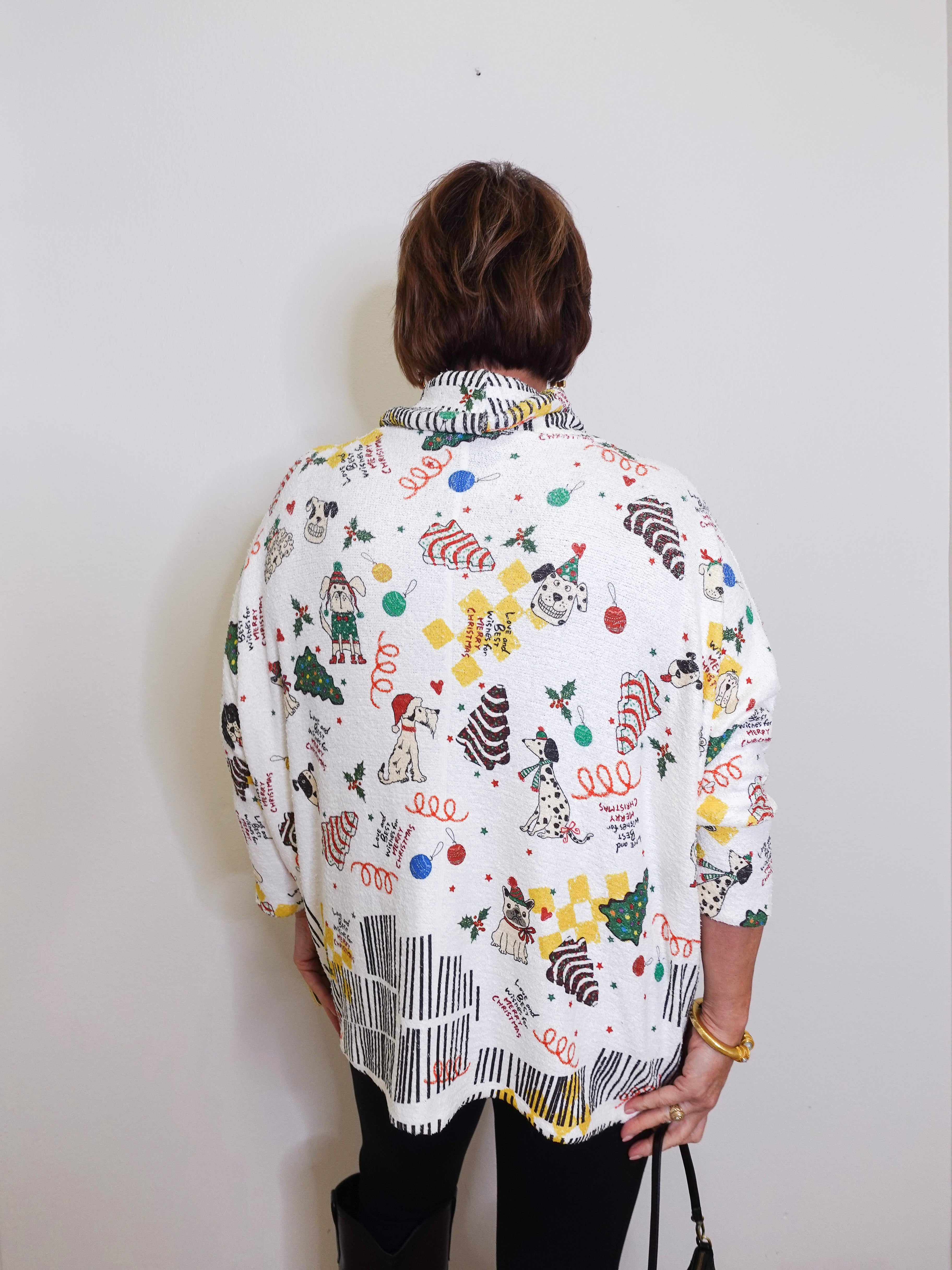 Person wearing a colorful patterned shirt with a plain background