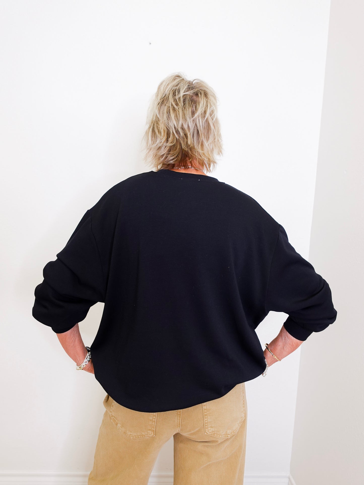 woman wearing a black sweatshirt