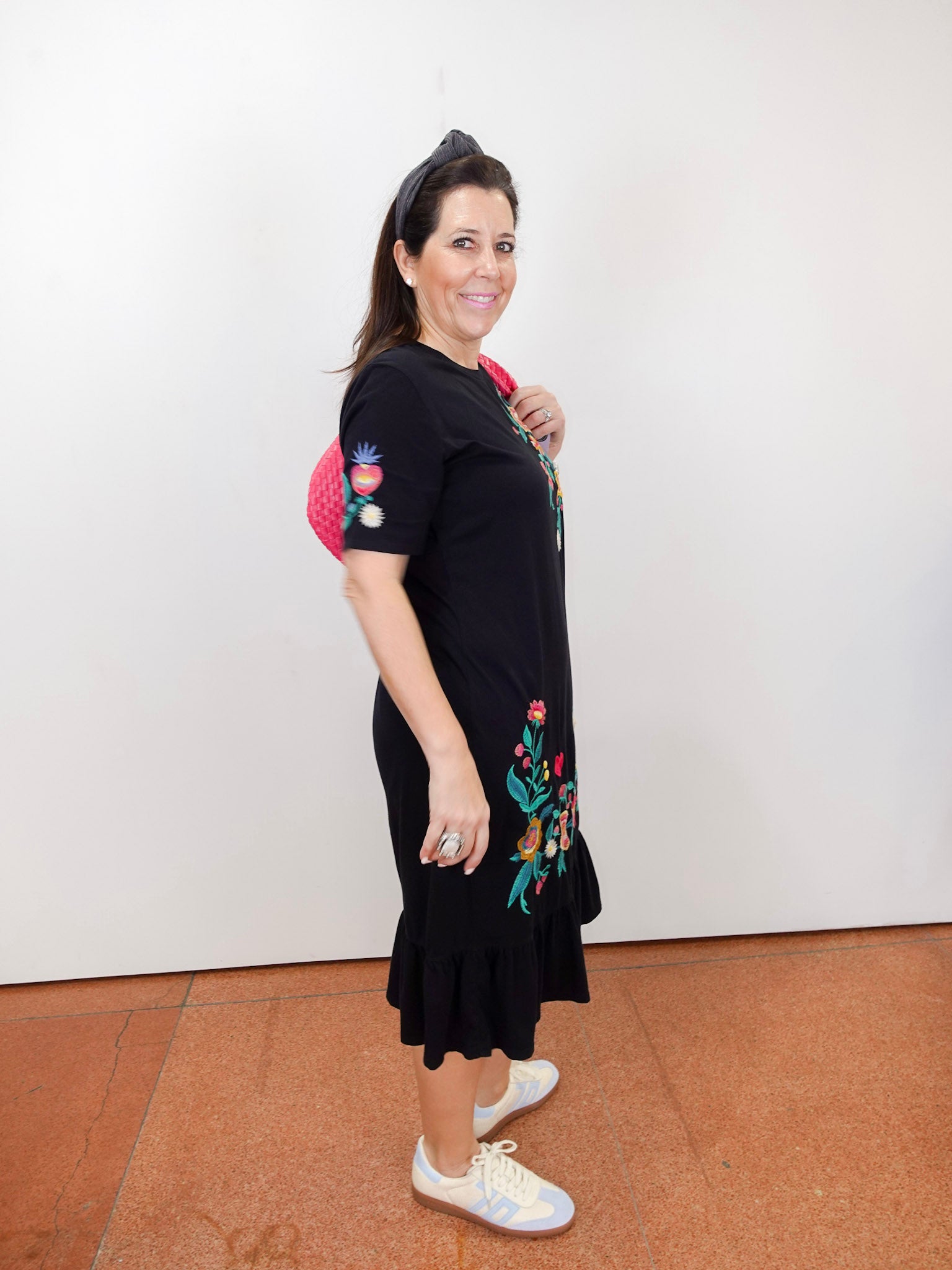 Zivana black ruffle knit midi dress with floral embroidery.